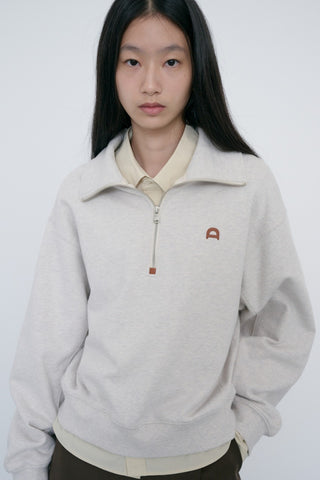 UNISEX LEATHER LOGO HALF ZIP-UP SWEATSHIRT OATMEAL MELANGE